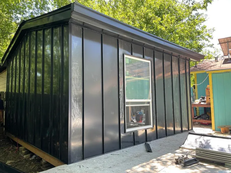 Black standing seam metal wall panels for Roof Inspection in Stanwood